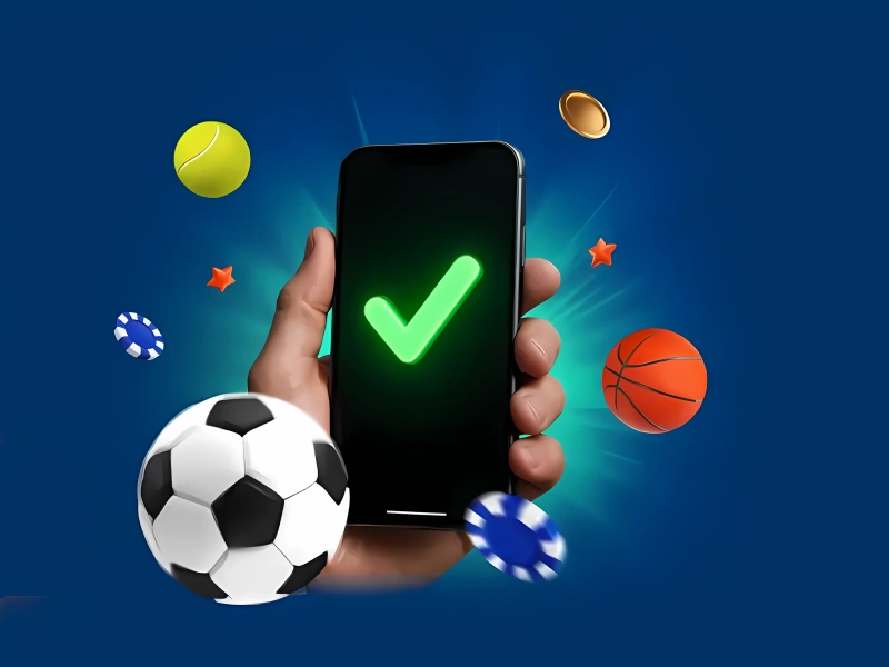 Smartphone surrounded by sports balls and casino chips, MostBet theme